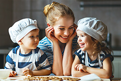 a mom and her sons in the kitchen